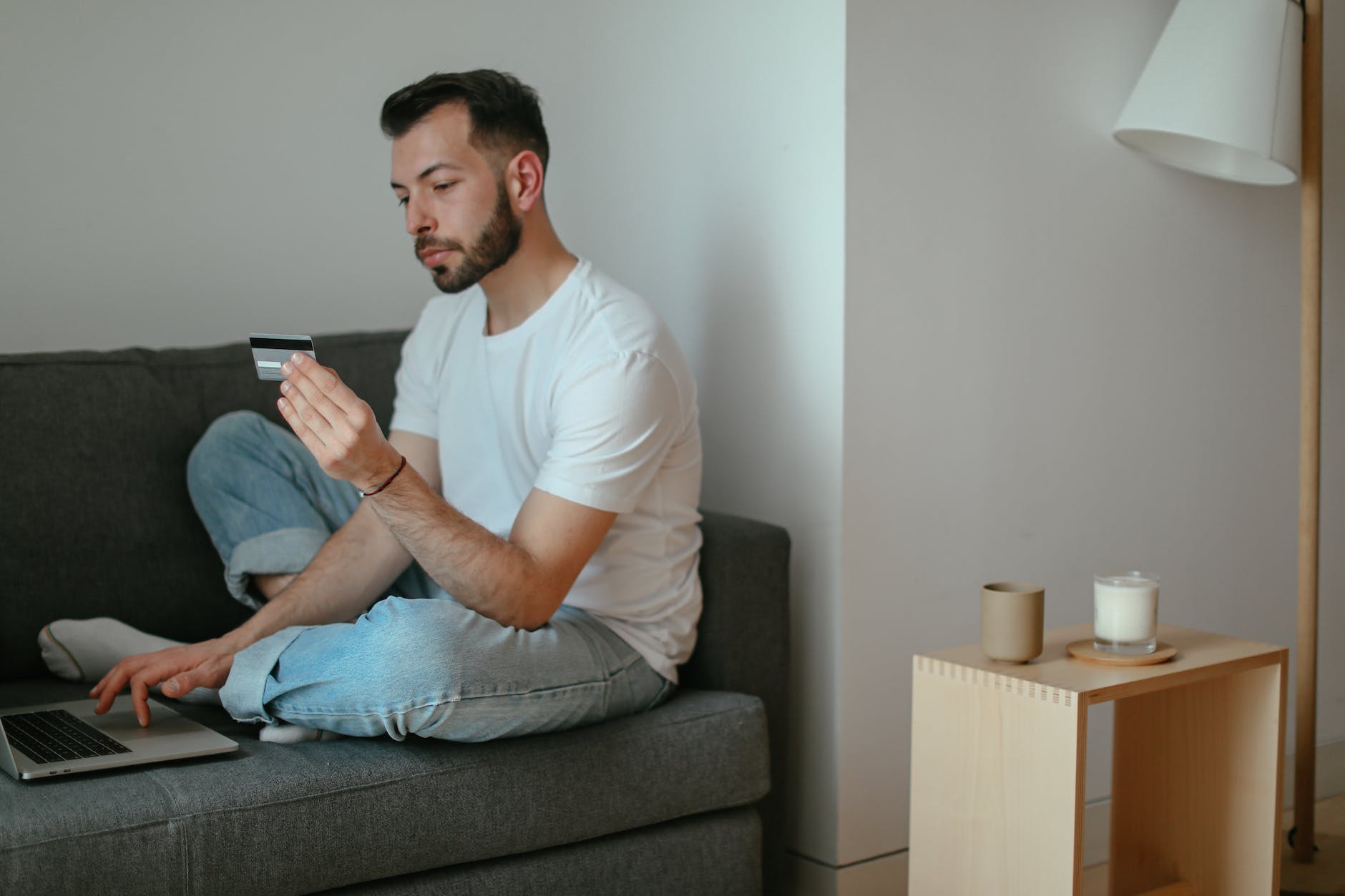 a man looking at his credit card details